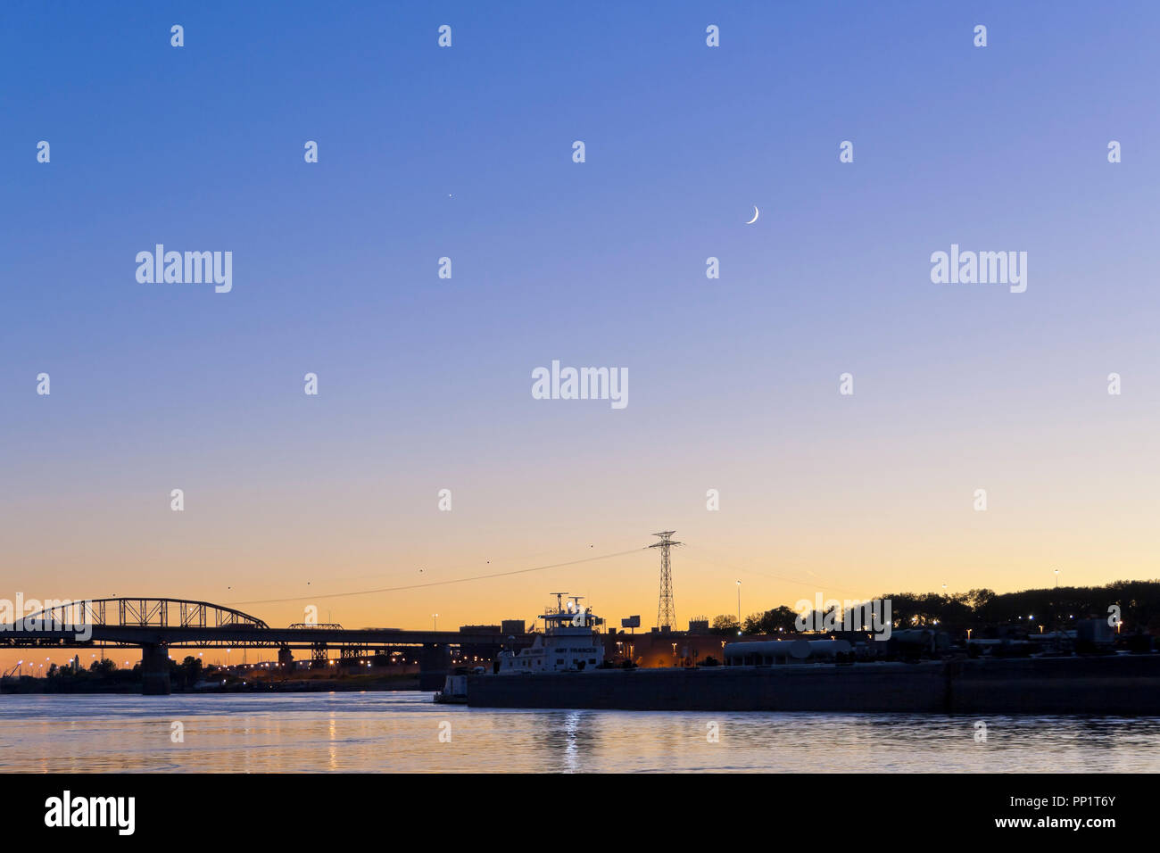 EAST ST. LOUIS, IL - OCTOBER 7: Venus and two-day-old crescent moon in conjuction over downtown St. Louis on 2013 Oct. 7. Stock Photo