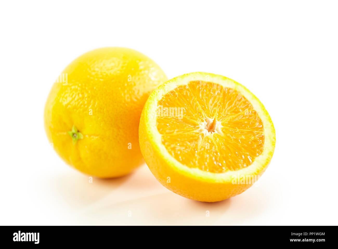 closeup of orange whole and half isolated on white background. Stock Photo