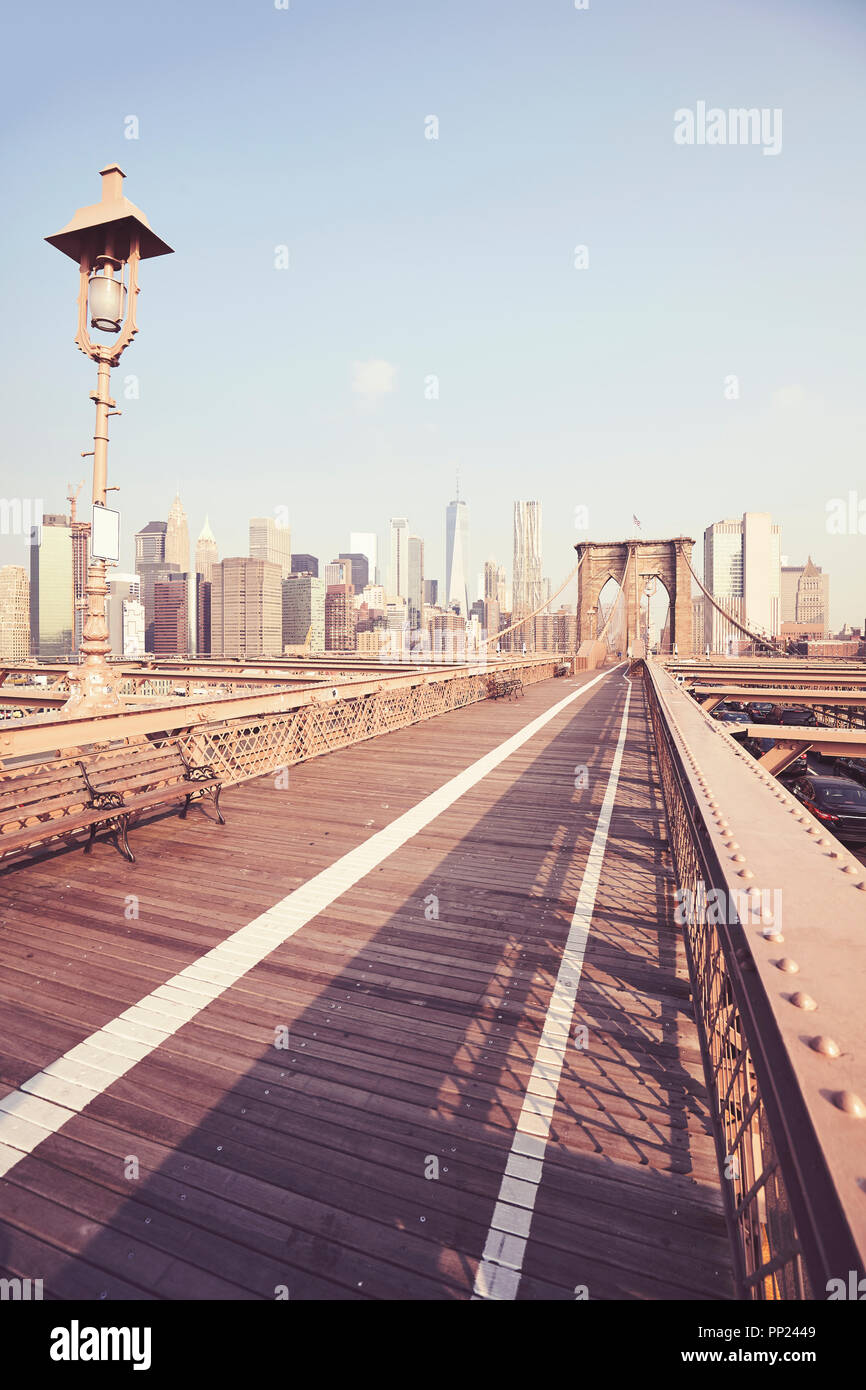 Retro stylized picture of the Brooklyn Bridge at sunrise, New York City ...