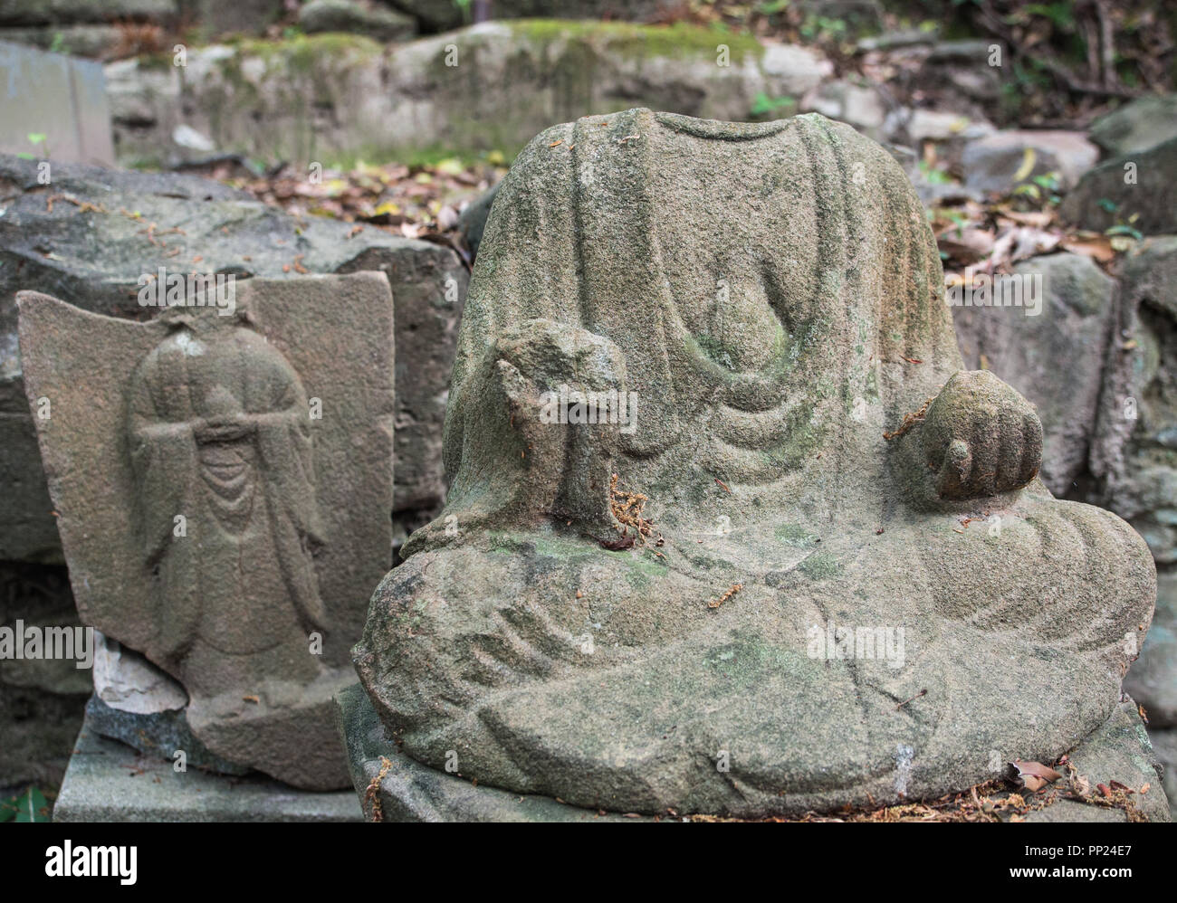 Headless gods, broken buddhist statues,  henro no michi pilgrim trail, Iyadaniji temple 71, Shikoku 88 temple pilgrimage, Kagawa, Japan Stock Photo