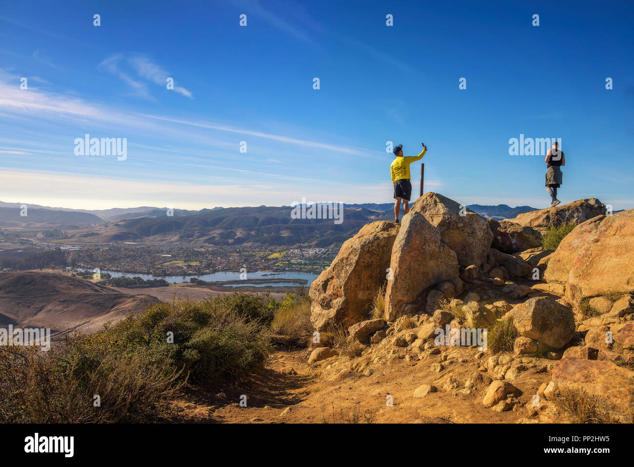 San Luis Obispo, California, USA - January 7, 2018 : Tourist takes a selfie photograph at the Cerro Peak above San Luis Obispo in California. Stock Photo