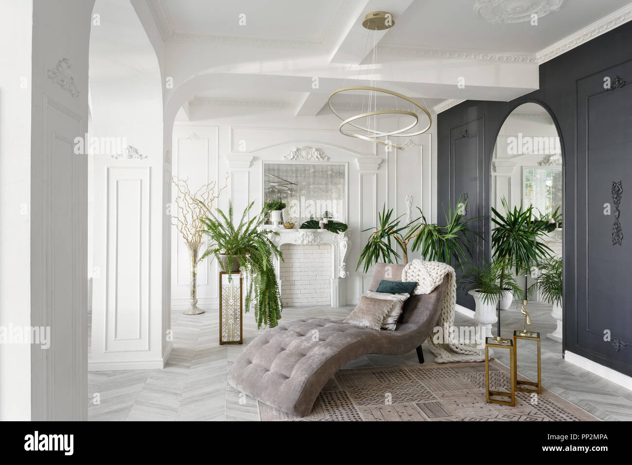 Morning in luxurious light interior in hotel bright and clean interior design of a luxury living room with parquet wood floors fireplace