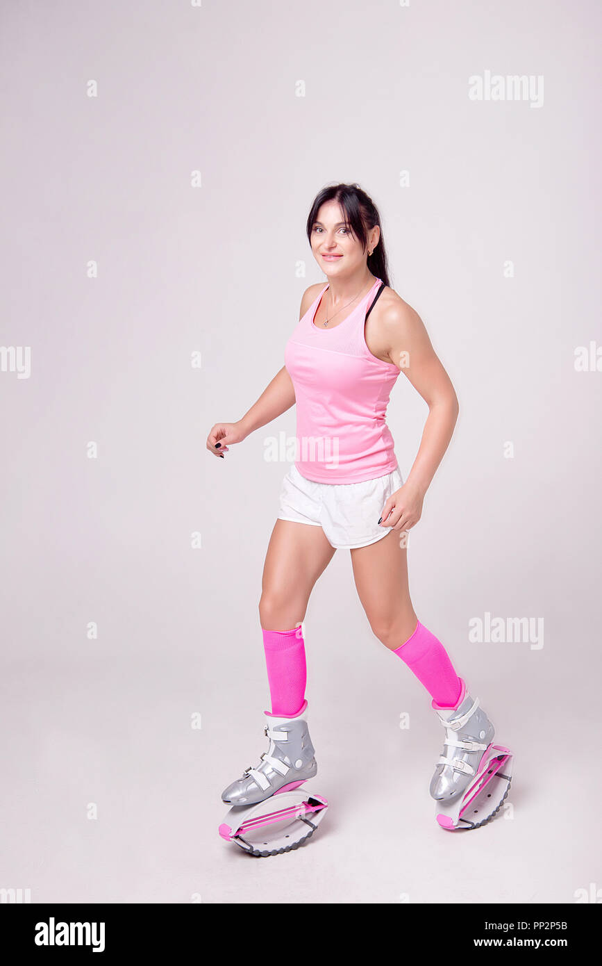 Beautiful athletic woman wearing in sports style clothing with