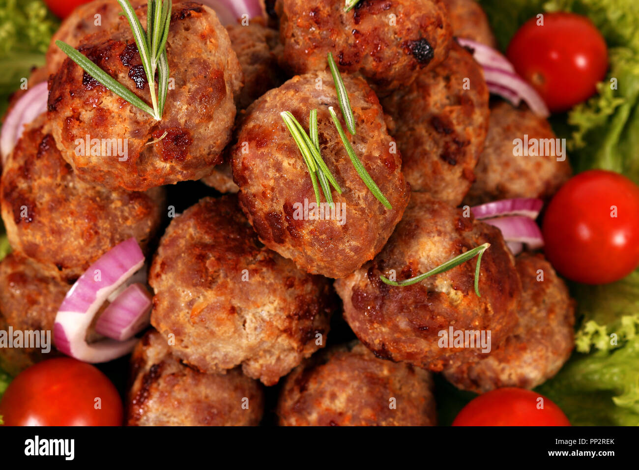 meatballs with tomatoes and salad close up Stock Photo