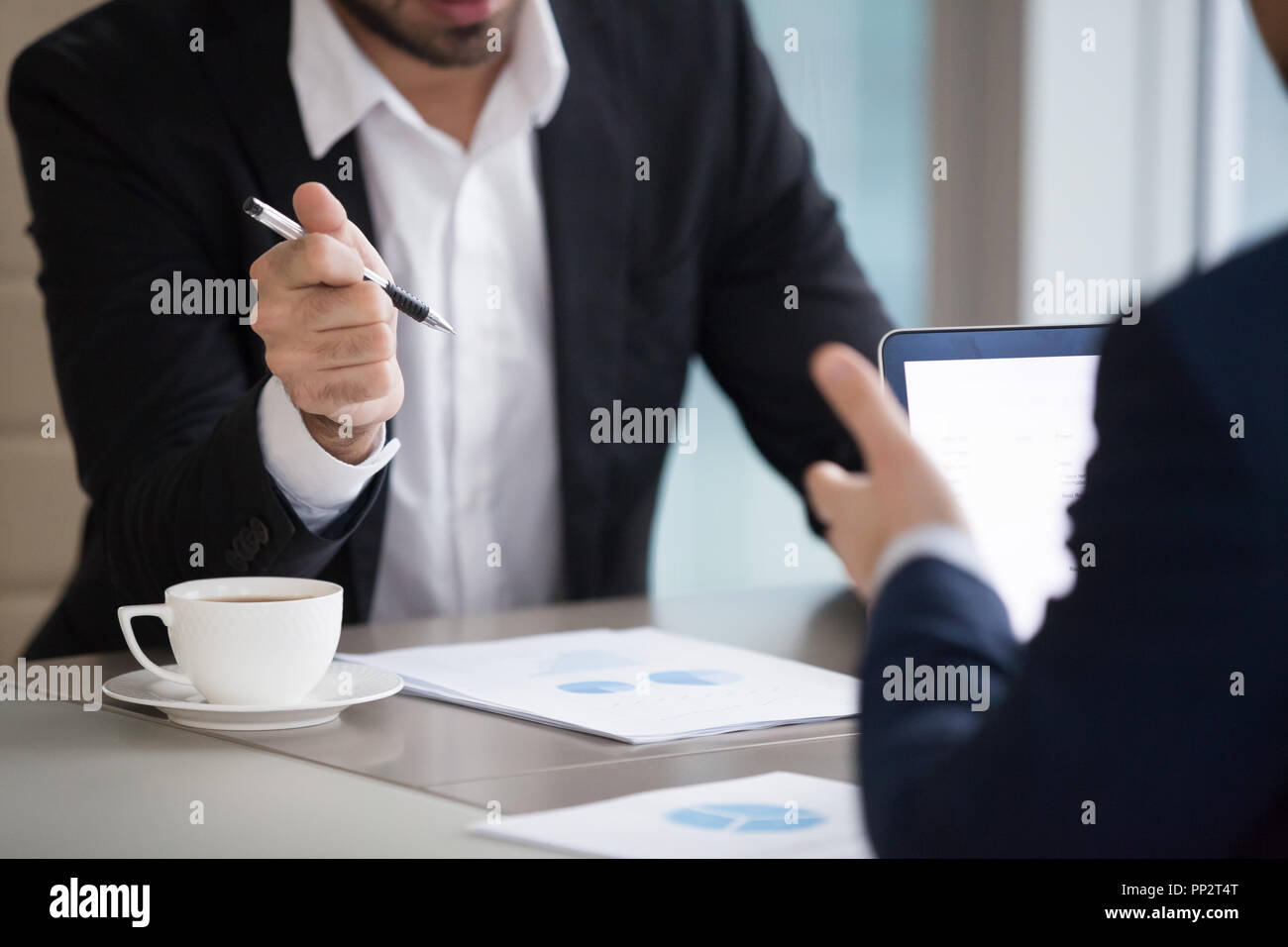 Close up of partners discuss statistics analyzing sales  Stock Photo