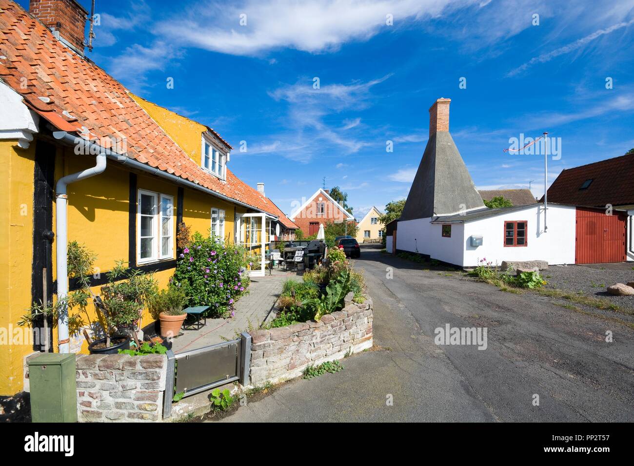 Small Colorful Half Timbered Houses In Aarsdale Bornholm Denmark Chimney Of Traditional Smokehouse In The Background Stock Photo Alamy