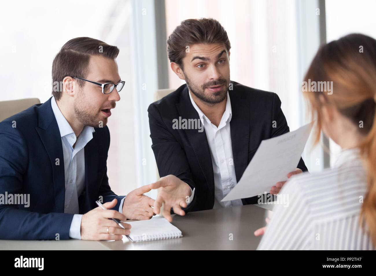 Male recruiters surprised with job candidate experience Stock Photo