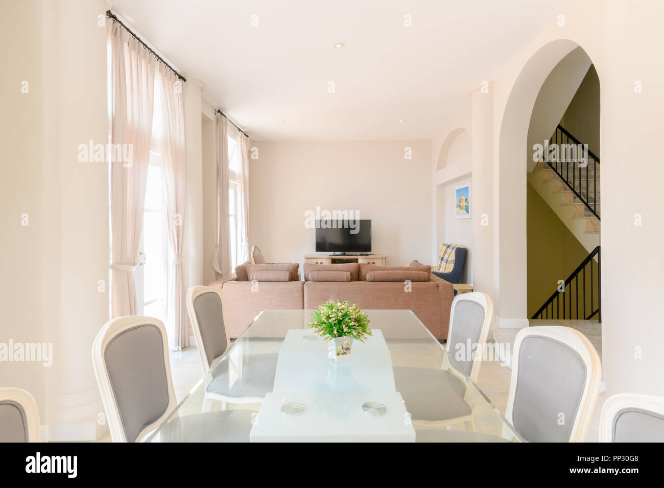Modern living room with dining table set, interior home Stock Photo