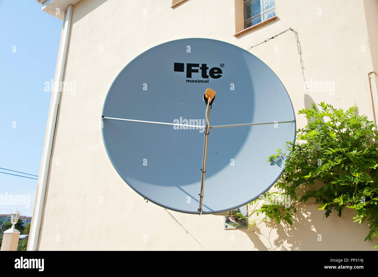 A large 150cm satellite dish can be used to view british television channels from Europe. This one is located in Spain. Stock Photo