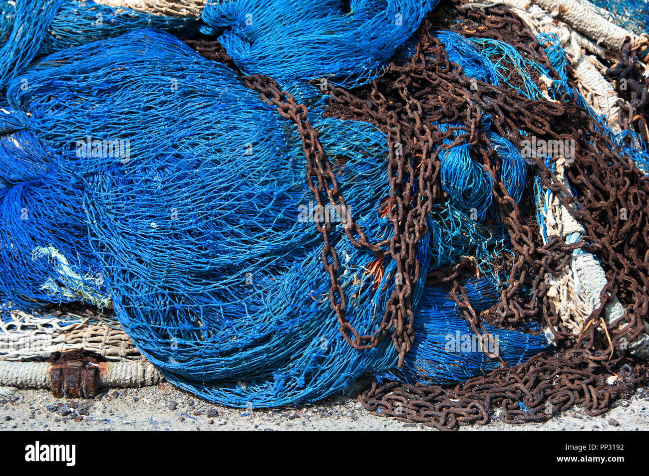 https://c8.alamy.com/comp/PP3192/colourful-fishing-nets-and-metal-chains-used-to-trawl-fish-by-fisherman-PP3192.jpg