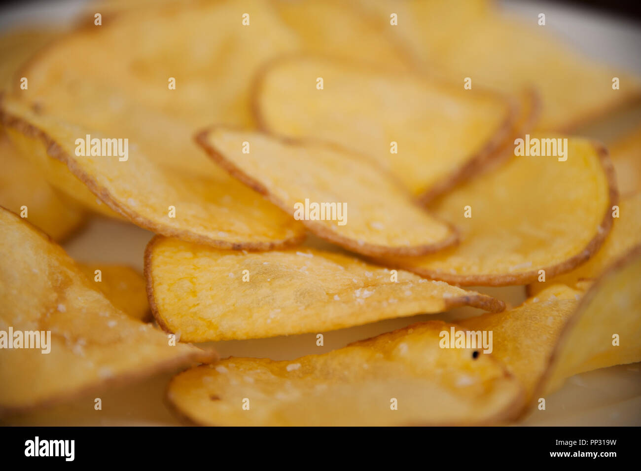 A plate of decorative fried potato chips which are sometimes called