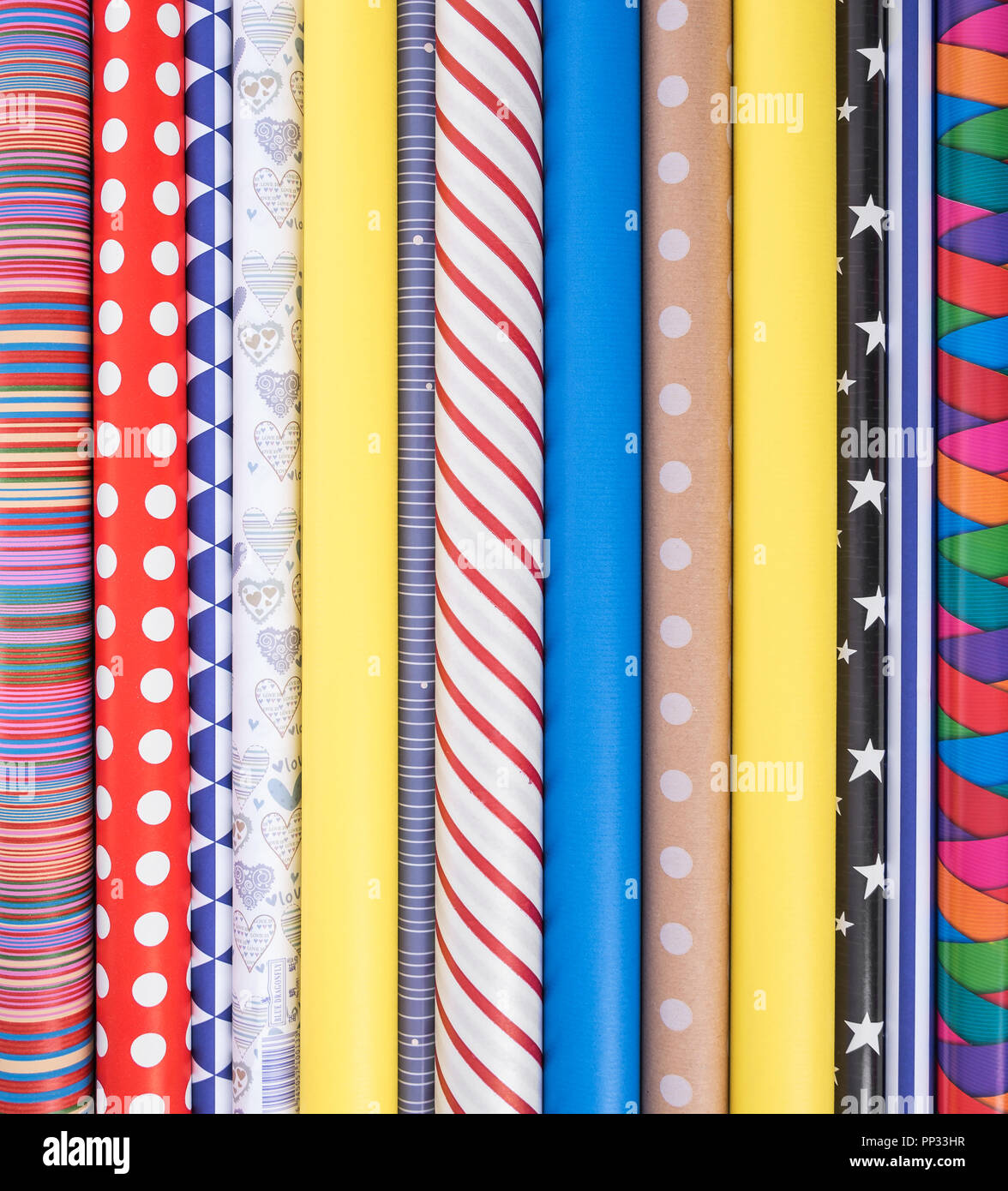 Colorful paper for wrapping gifts. Preparing for a holiday Stock Photo ...