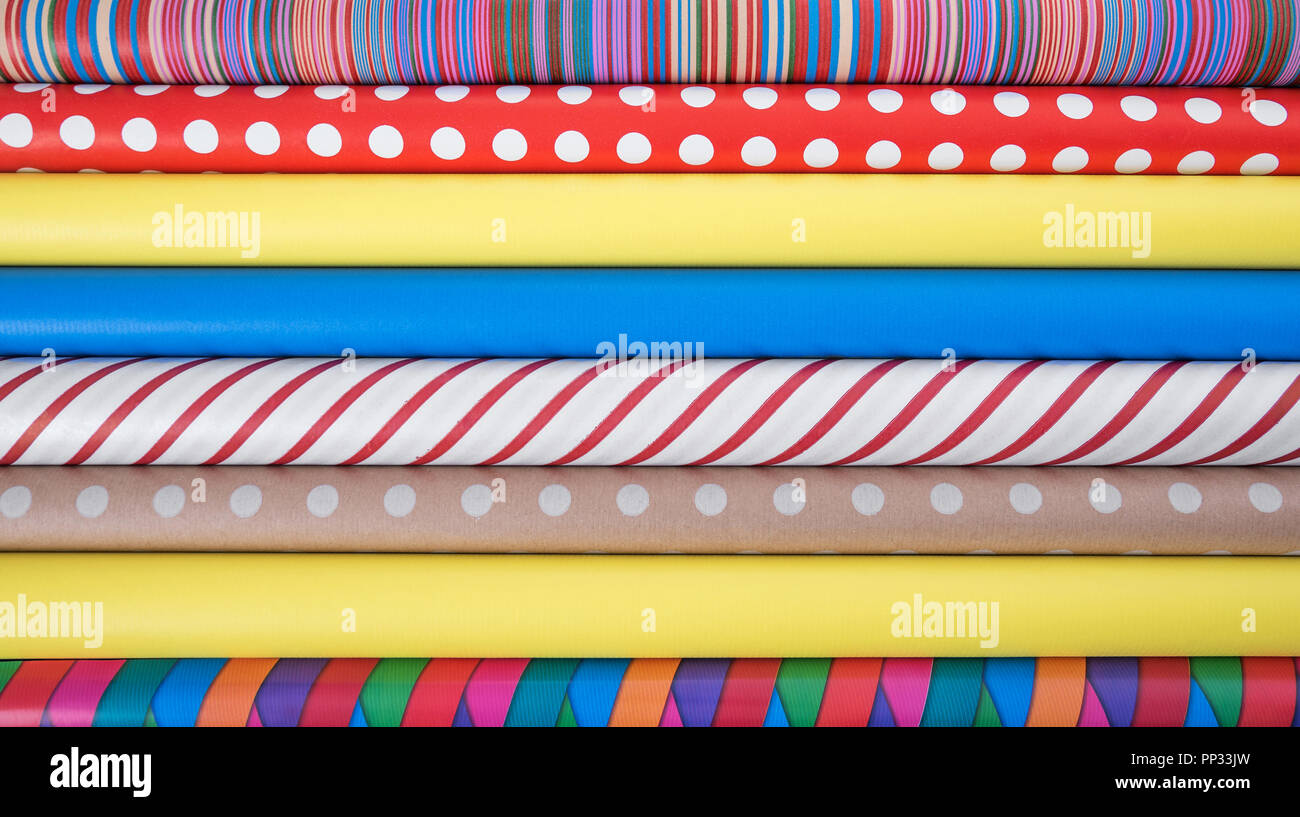 Colorful paper for wrapping gifts. Preparing for a holiday. Stock Photo