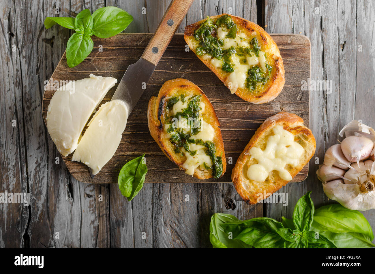 Garlic herbs toast with fresh mozzarella, food photography, vintage photography Stock Photo