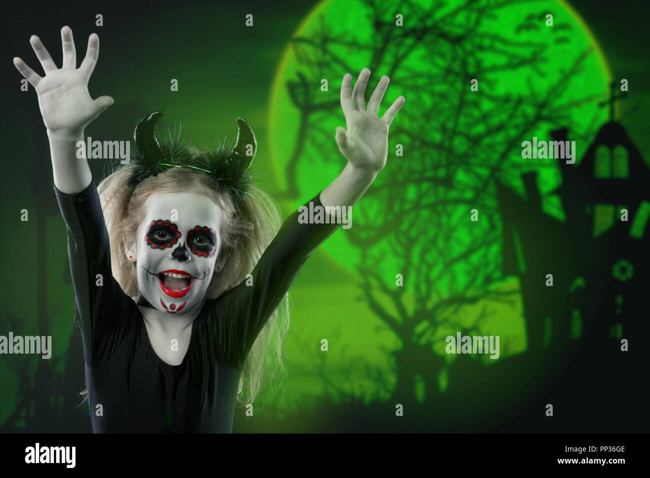Halloween Holidays Masquerade Concept The Portrait Of Young Little Beautiful Girl With Skull Makeup And Horns Halloween Face Art Skull Make Up Stock Photo Alamy