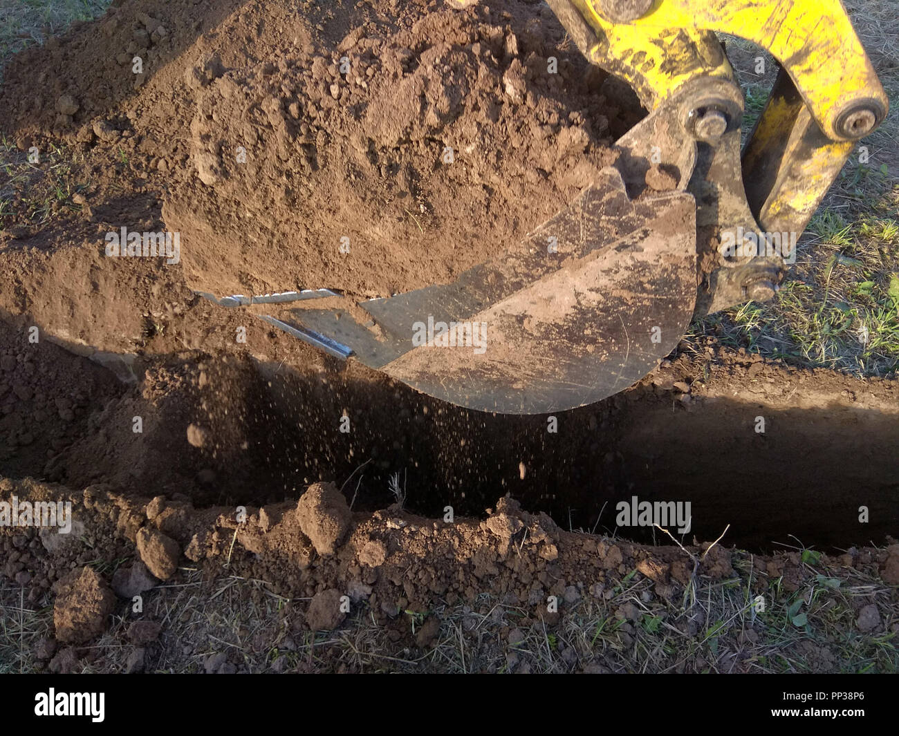 Excavator digger machine at canal construction site hi-res stock ...
