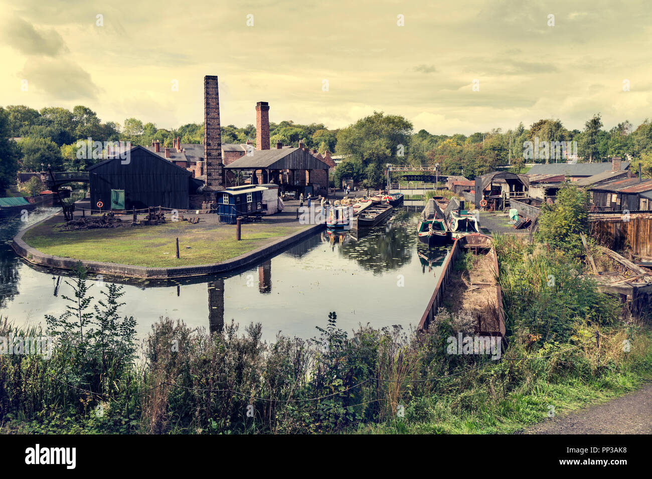 Boat dock, canal basin and the workshop buildings at Black Country Living Museum, Dudley, UK Stock Photo
