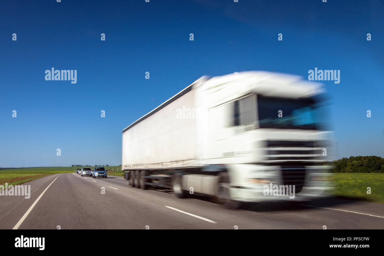 Delivery truck on left side traffic highway with speed effect Stock ...