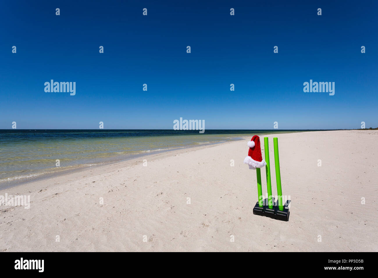 Cricket wickets on a beautiful Australian beach during the festive season. Stock Photo
