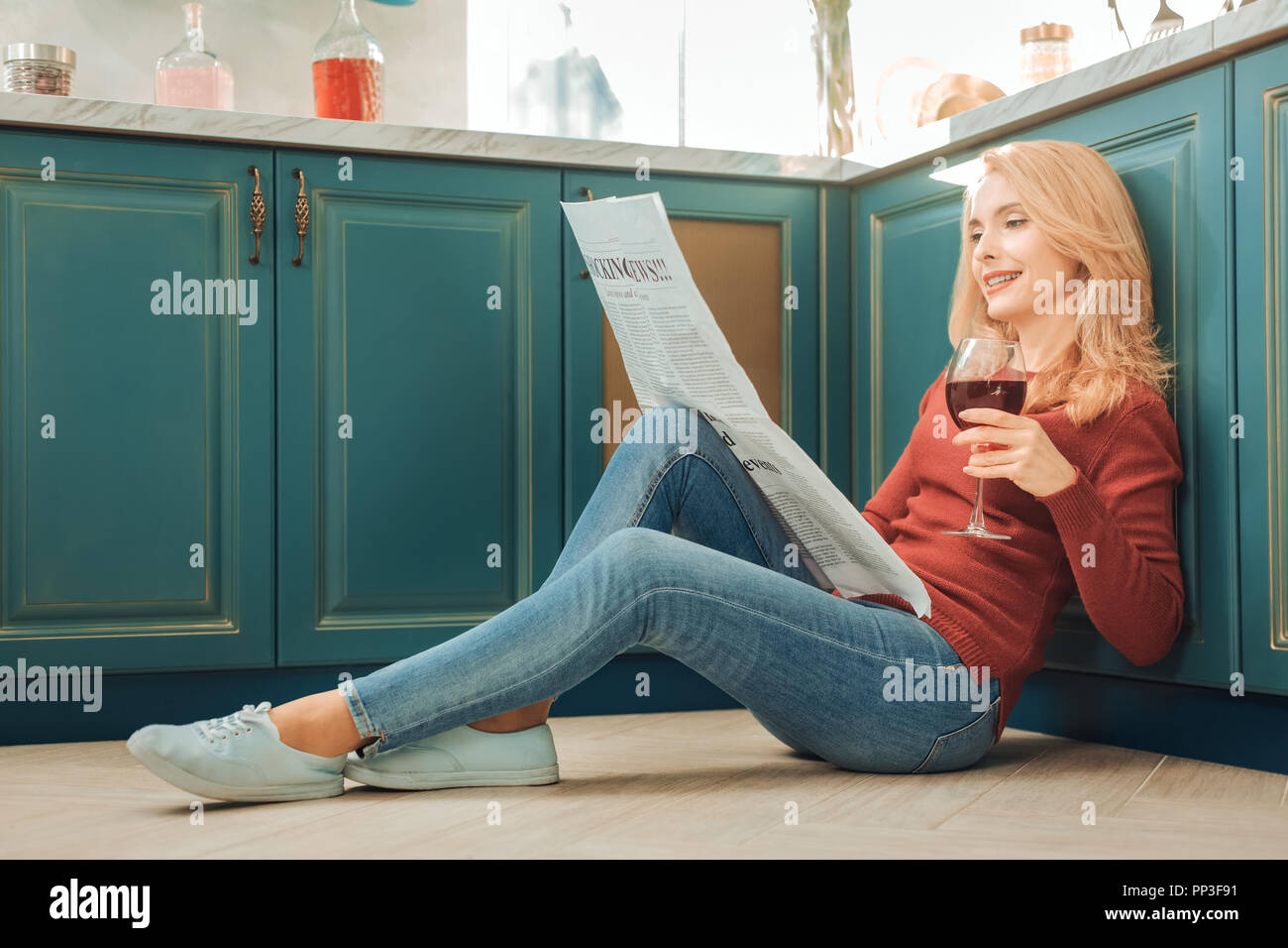 Pleased young woman enjoying her home day Stock Photo