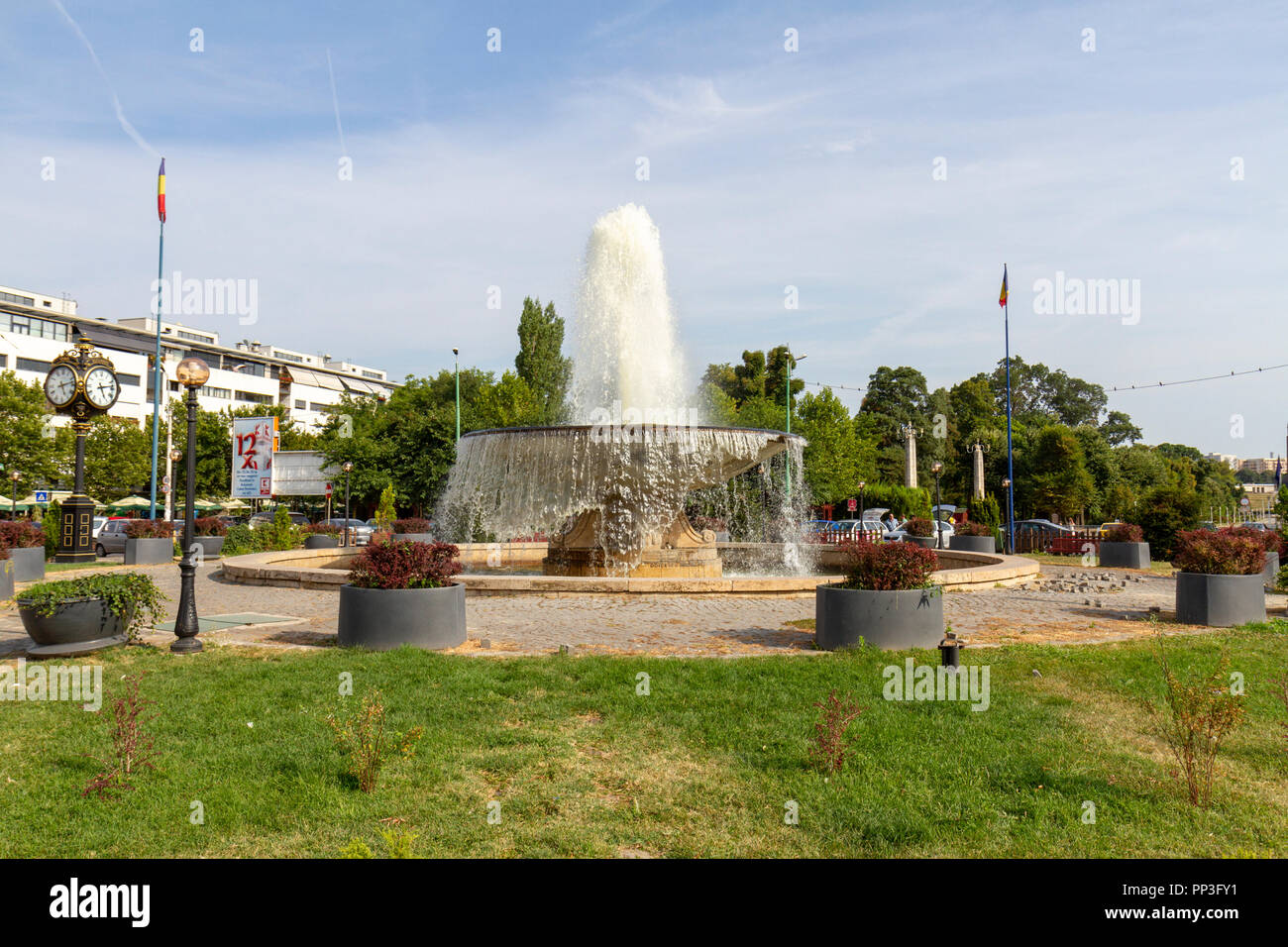 The Fântâna Zodiac (Zodiac Fountain) Liberty Square, at the entrance to Carol Park, Bucharest, Romania. The Nation's Heroes Memorial is visible. Stock Photo