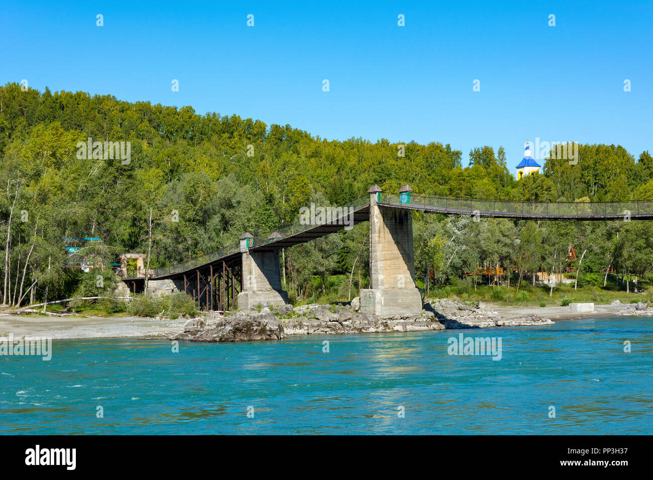 Old Aysky Suspension Bridge over the Katun River near the village of Aya, Altai Krai Stock Photo