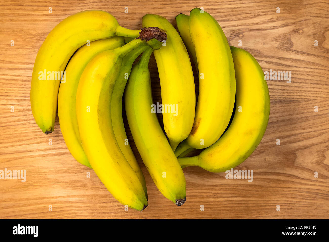 bananas over an wooden plate Stock Photo