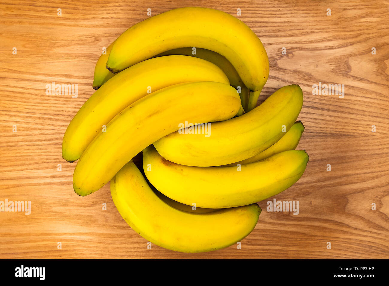 bananas over an wooden plate Stock Photo