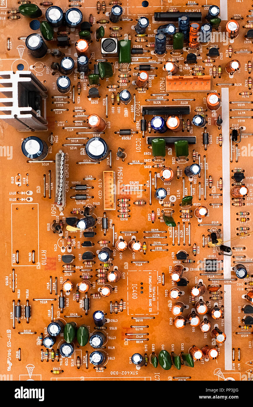 printed circuit board with chips transistors and processors of an old CD player made in the 1990s Stock Photo