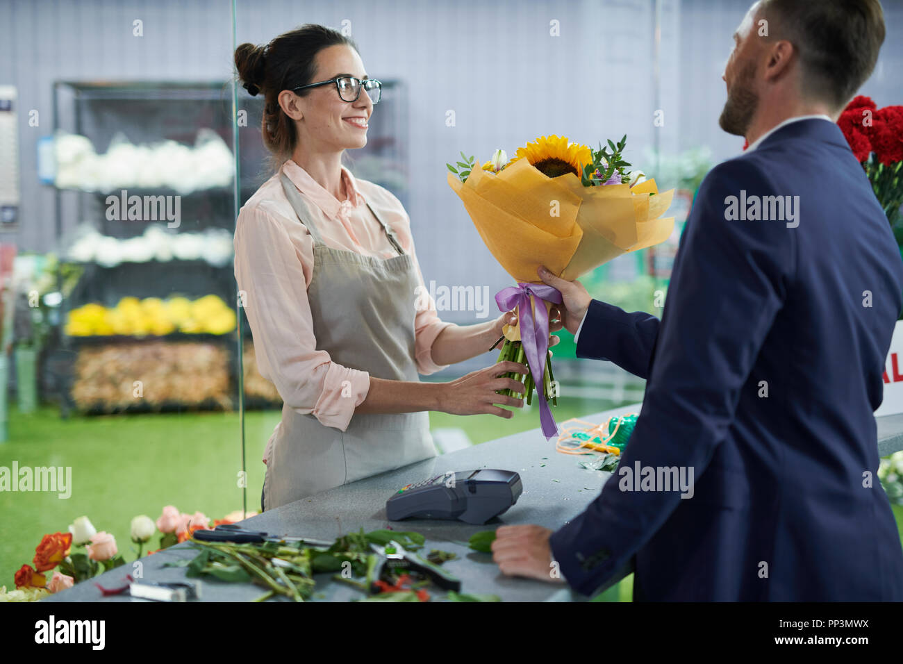 Woman Selling Flowers Stock Photo Alamy