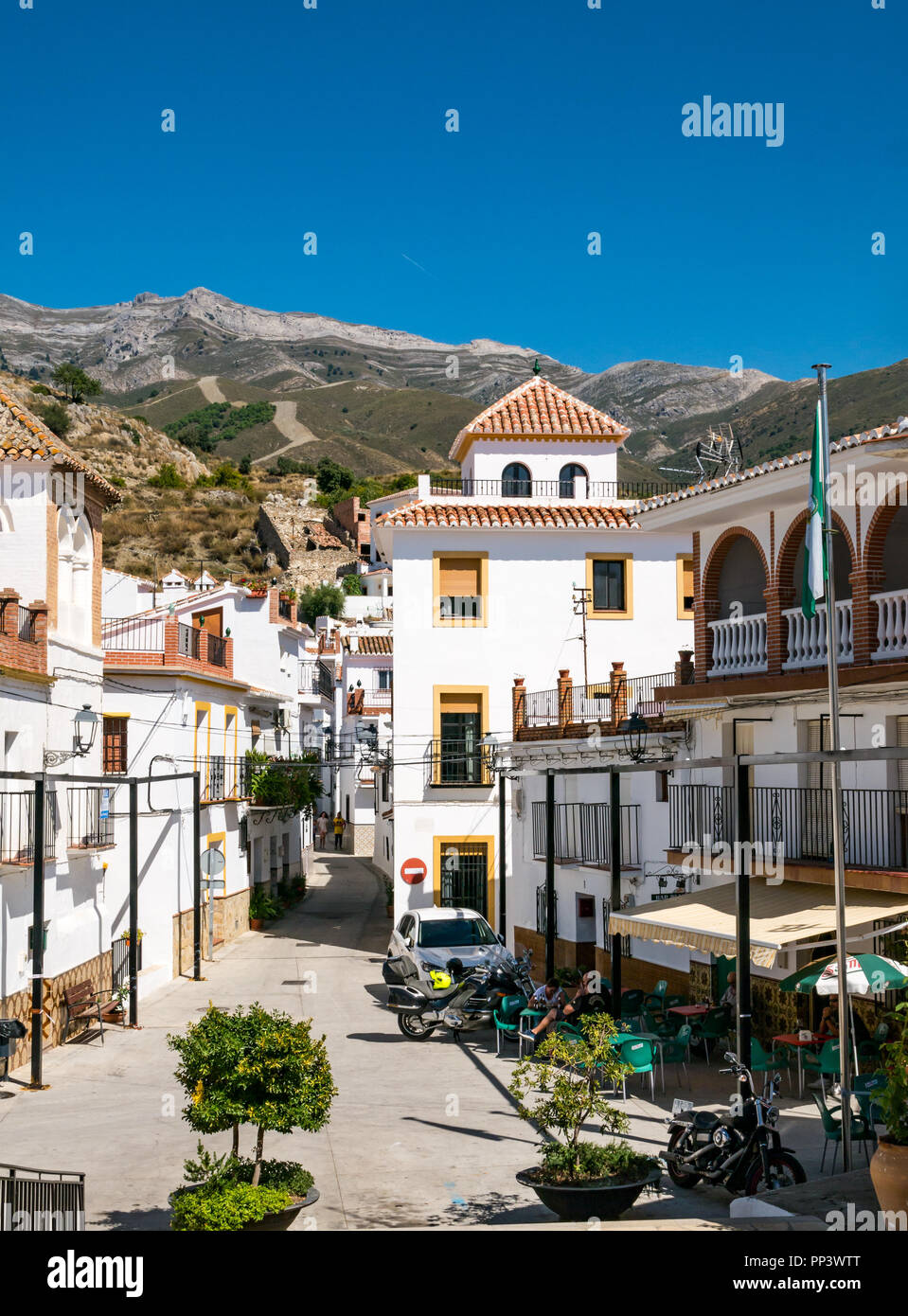 Plaza Francisco Ruiz with people sitting at cafe tables, Sedella, Axarquia, Andalusia, Spain Stock Photo