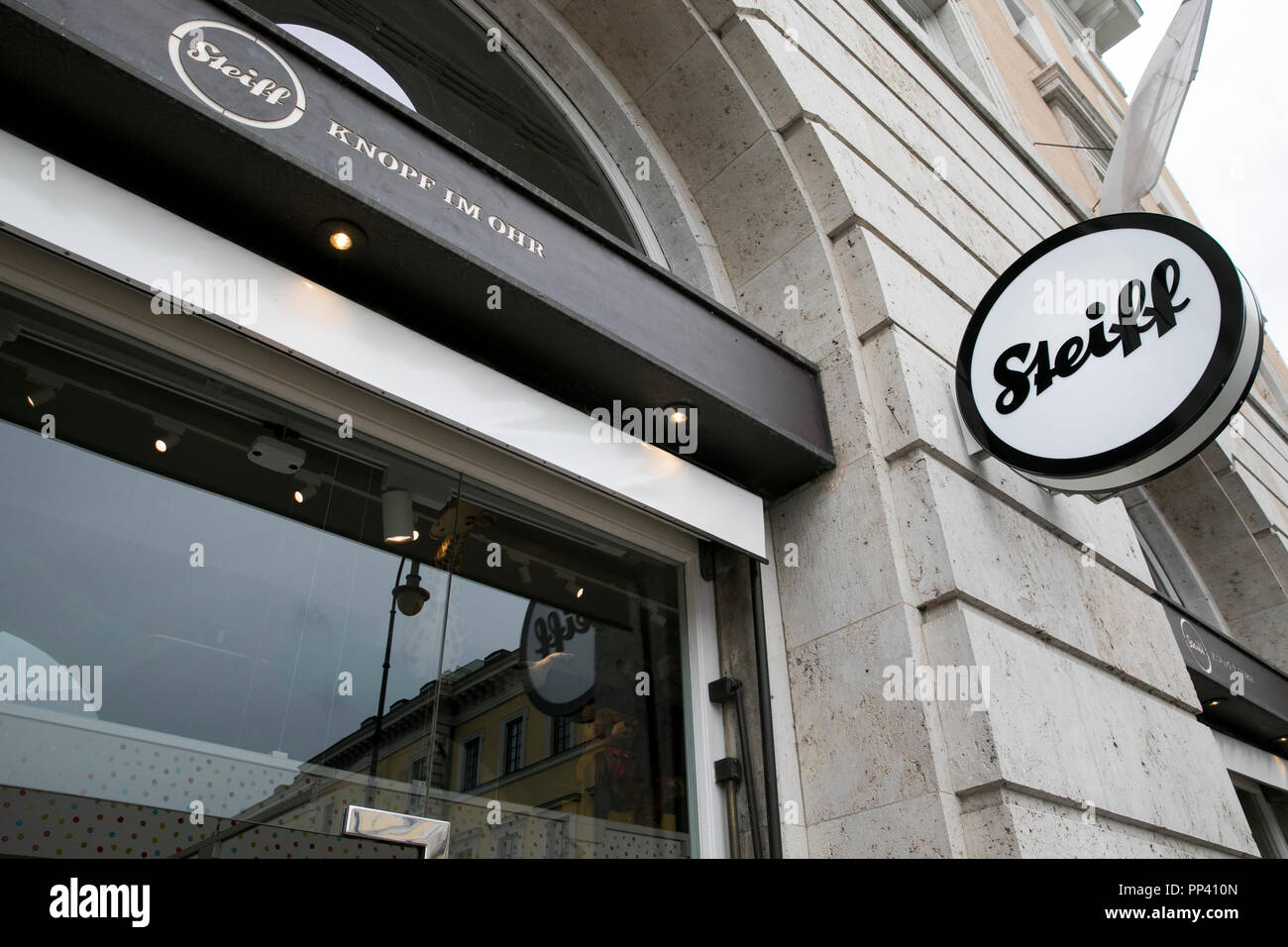 A logo sign outside of a Steiff retail toy store in Munich, Germany on
