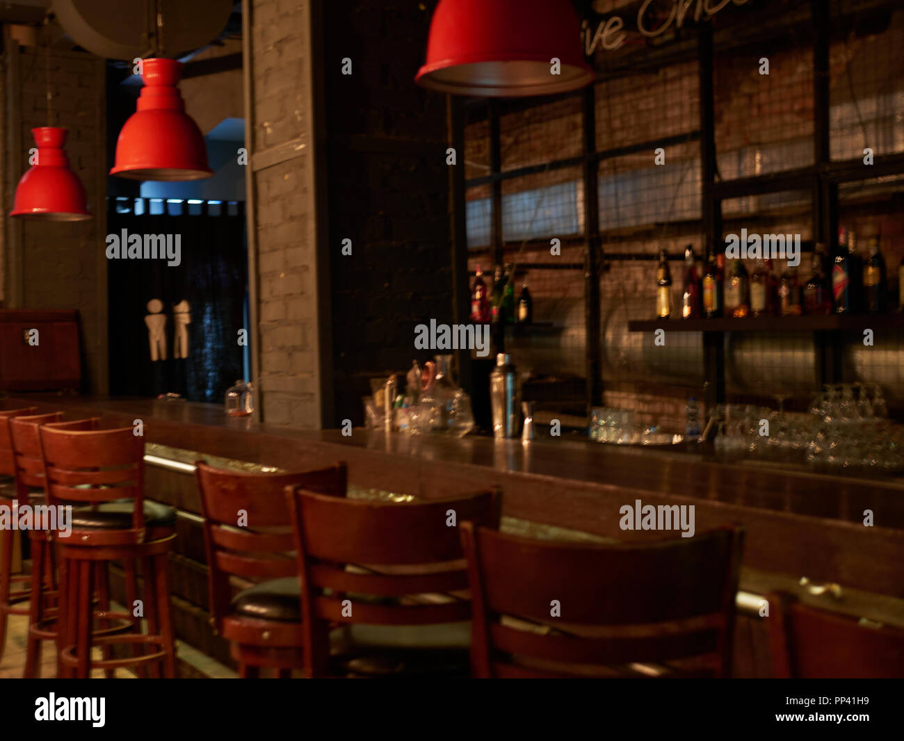 Modern jazz bar interior design, stage with black piano and cello, lamps  above bar counter Stock Photo - Alamy