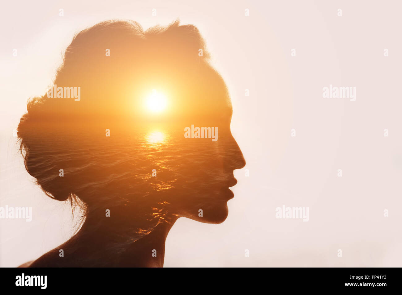 Philosophy concept. Sunrise and woman silhouette. Stock Photo