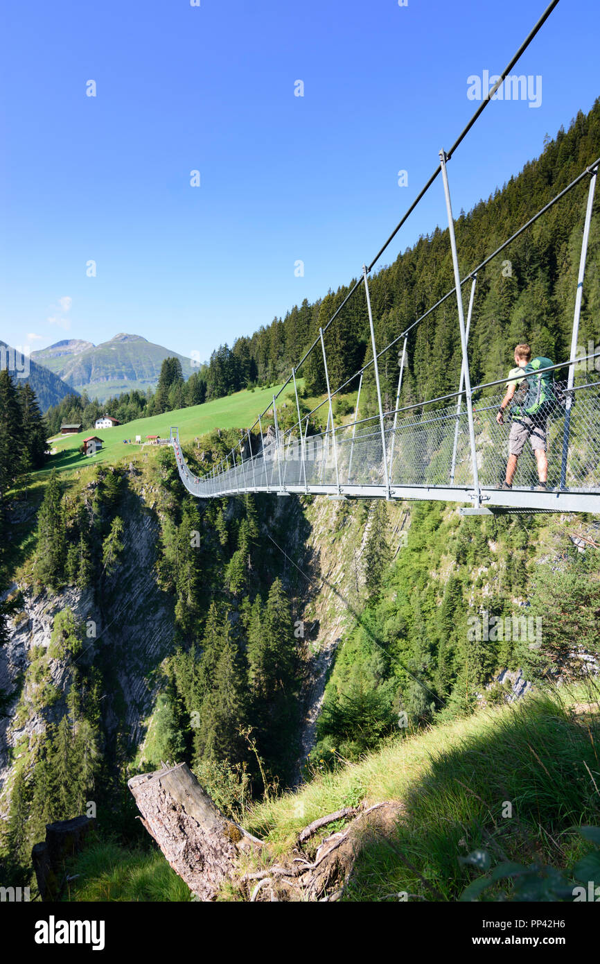 Holzgau: Hängebrücke (suspension bridge), hiker, Lechtal Valley, Tirol, Tyrol, Austria Stock Photo