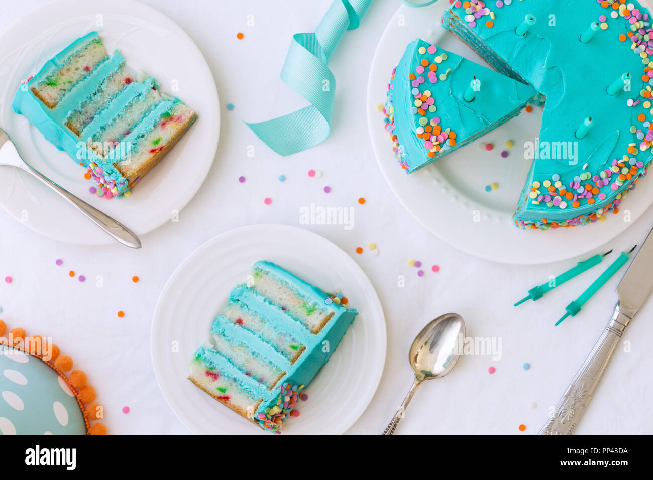 Birthday cake with colorful frosting and sprinkles Stock Photo - Alamy