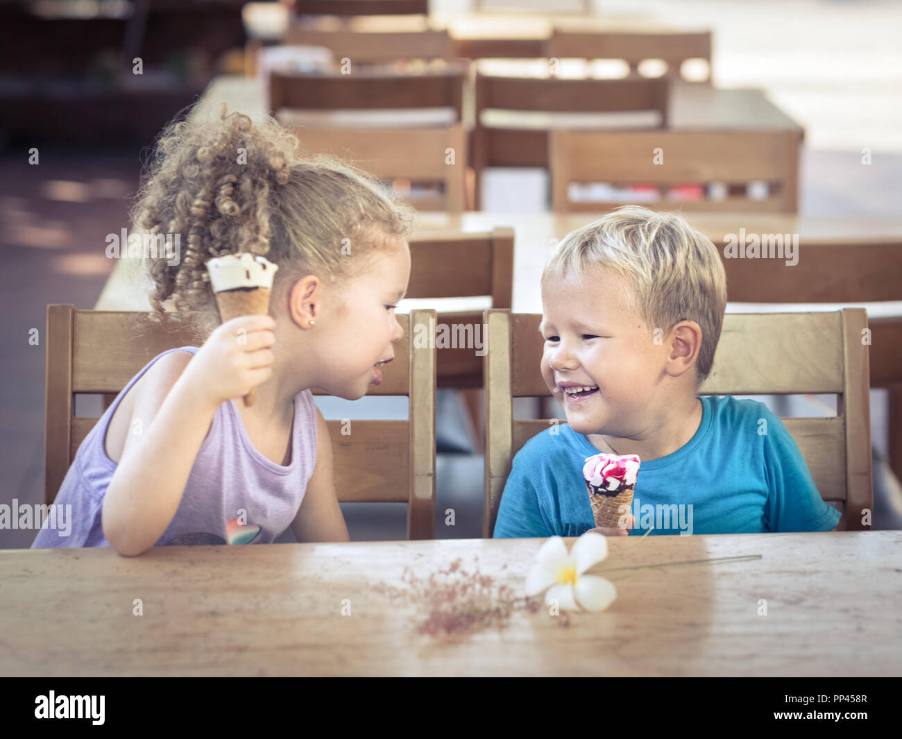 Cute kids are eating ice cream Stock Photo