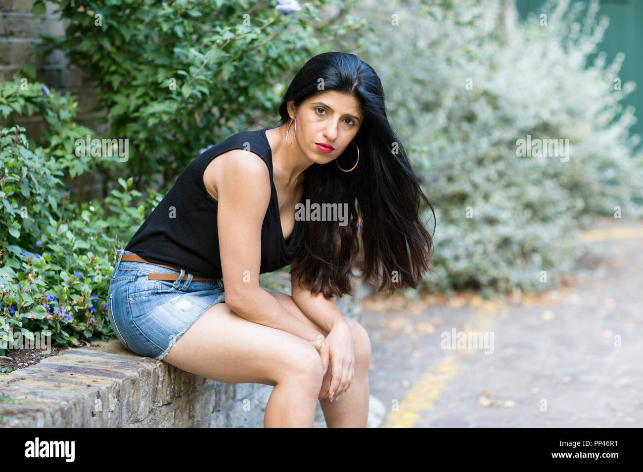 Indian girl sitting alone on hi-res stock photography and images - Alamy