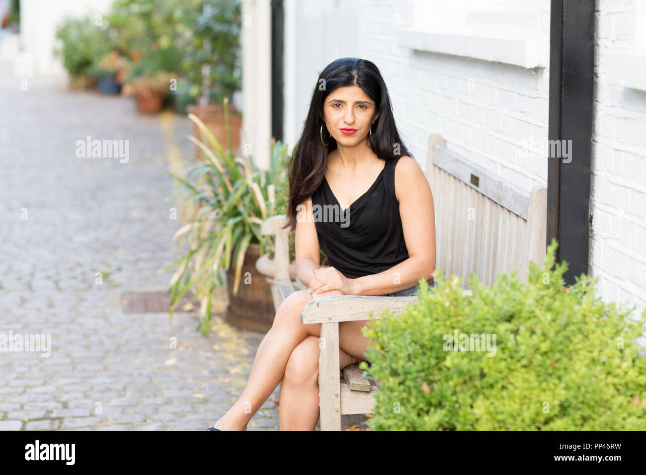Indian girl sitting on bench hi-res stock photography and images - Alamy
