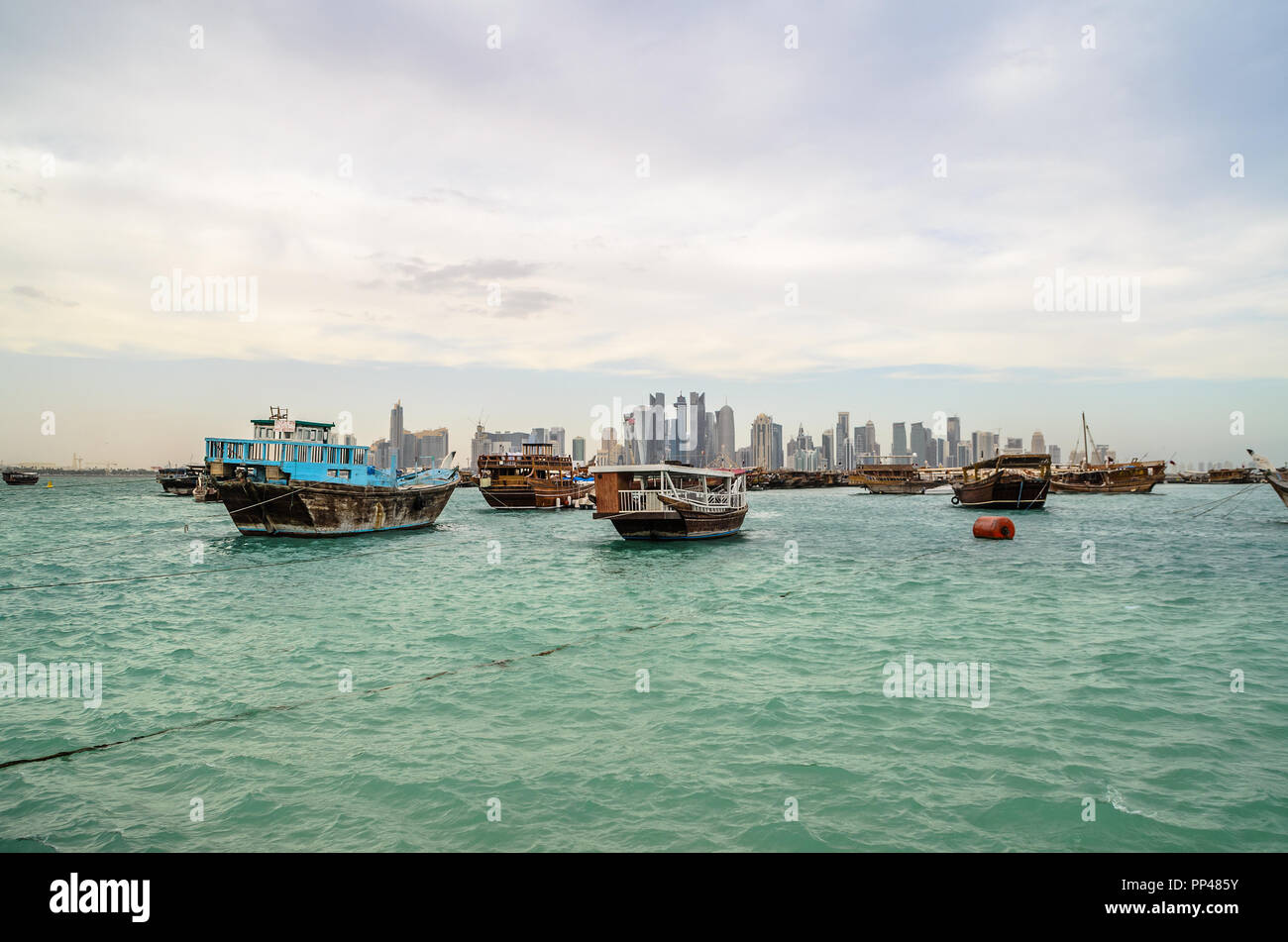 Traditional dhows moored at Doha corniche, Qatar Stock Photo