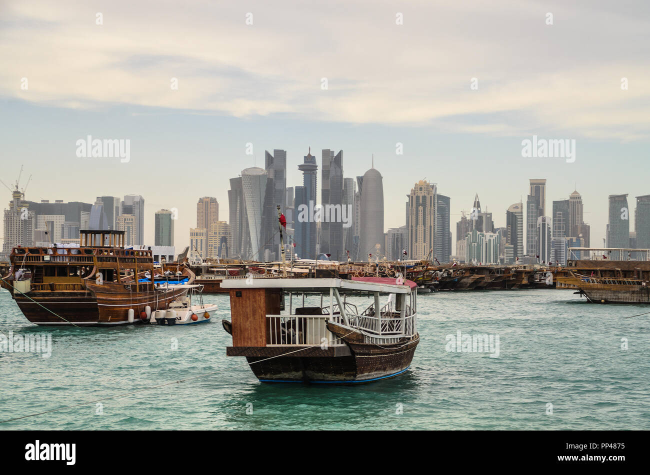 Traditional dhows moored at Doha corniche, Qatar Stock Photo