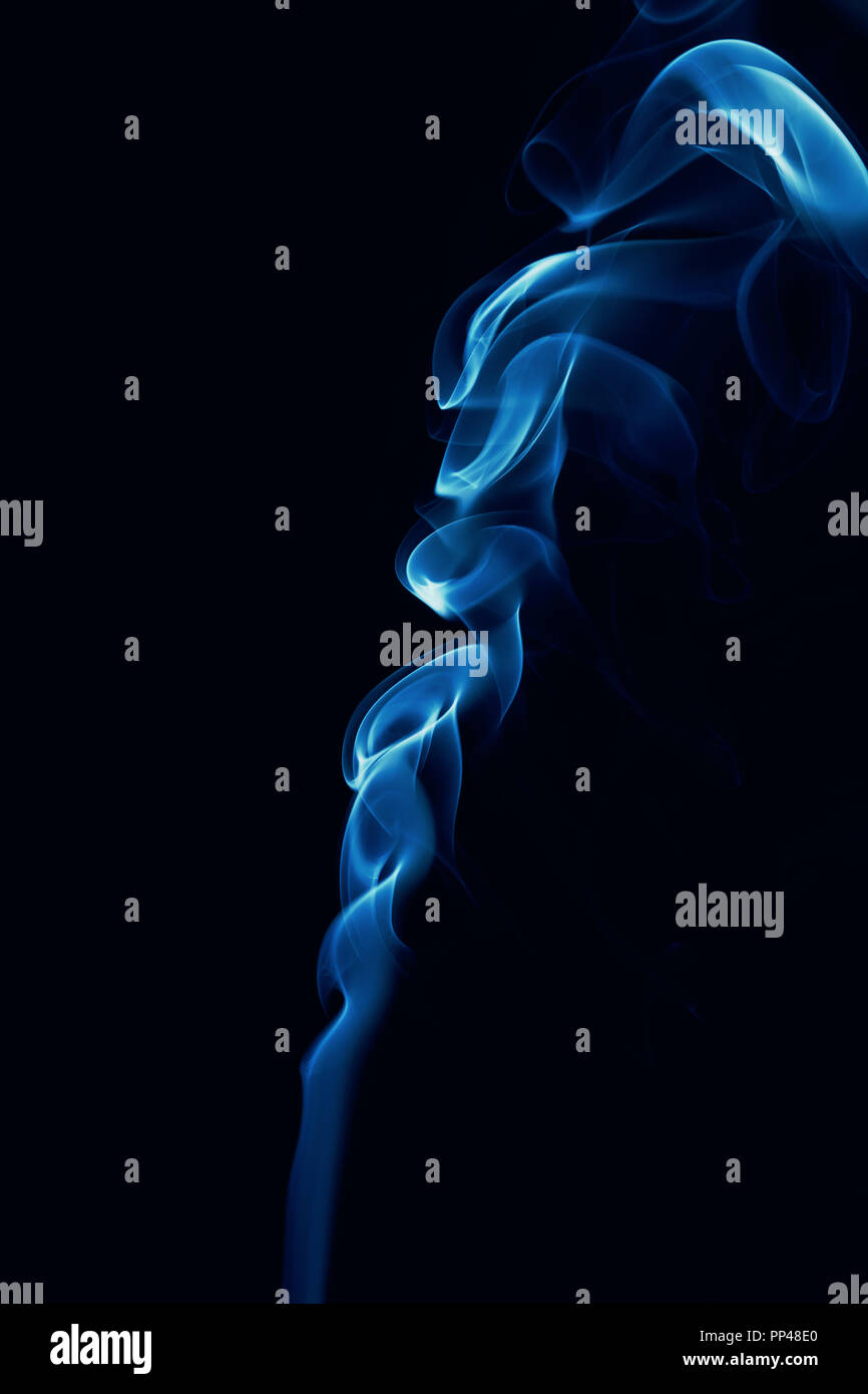 Movement of blue smoke isolated on black background Stock Photo - Alamy