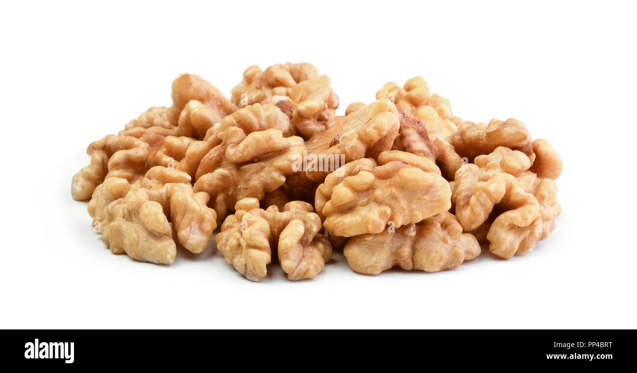 Pile of half walnuts isolated on white background Stock Photo