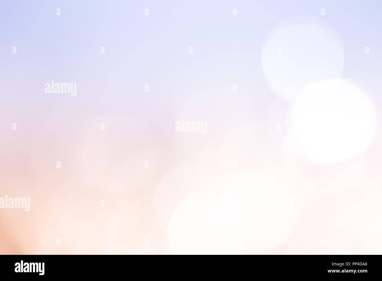 Peach and light blue bokeh lights abstract background. Stock Photo