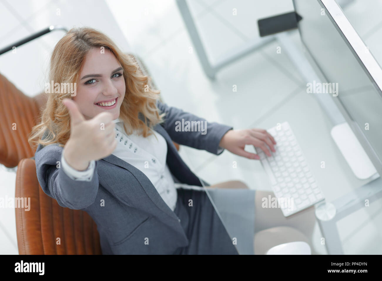 business woman showing thumb up Stock Photo - Alamy