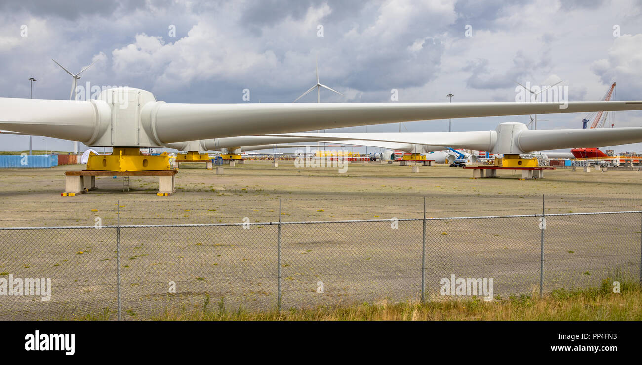 Giant rotors of wind turbine on windmill assambly site to build windfarms at sea Stock Photo