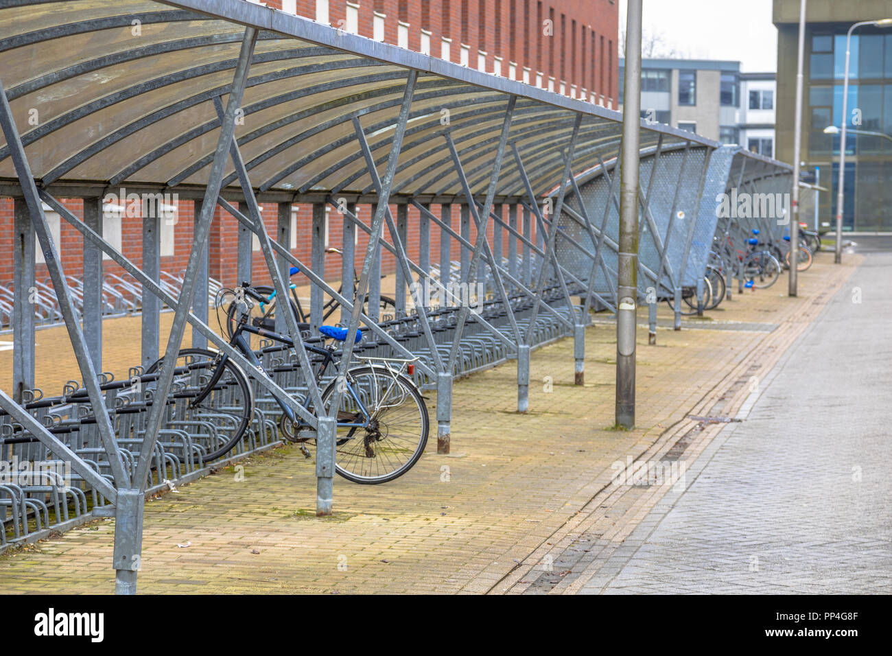 Empty bicycle storage on university campus Stock Photo