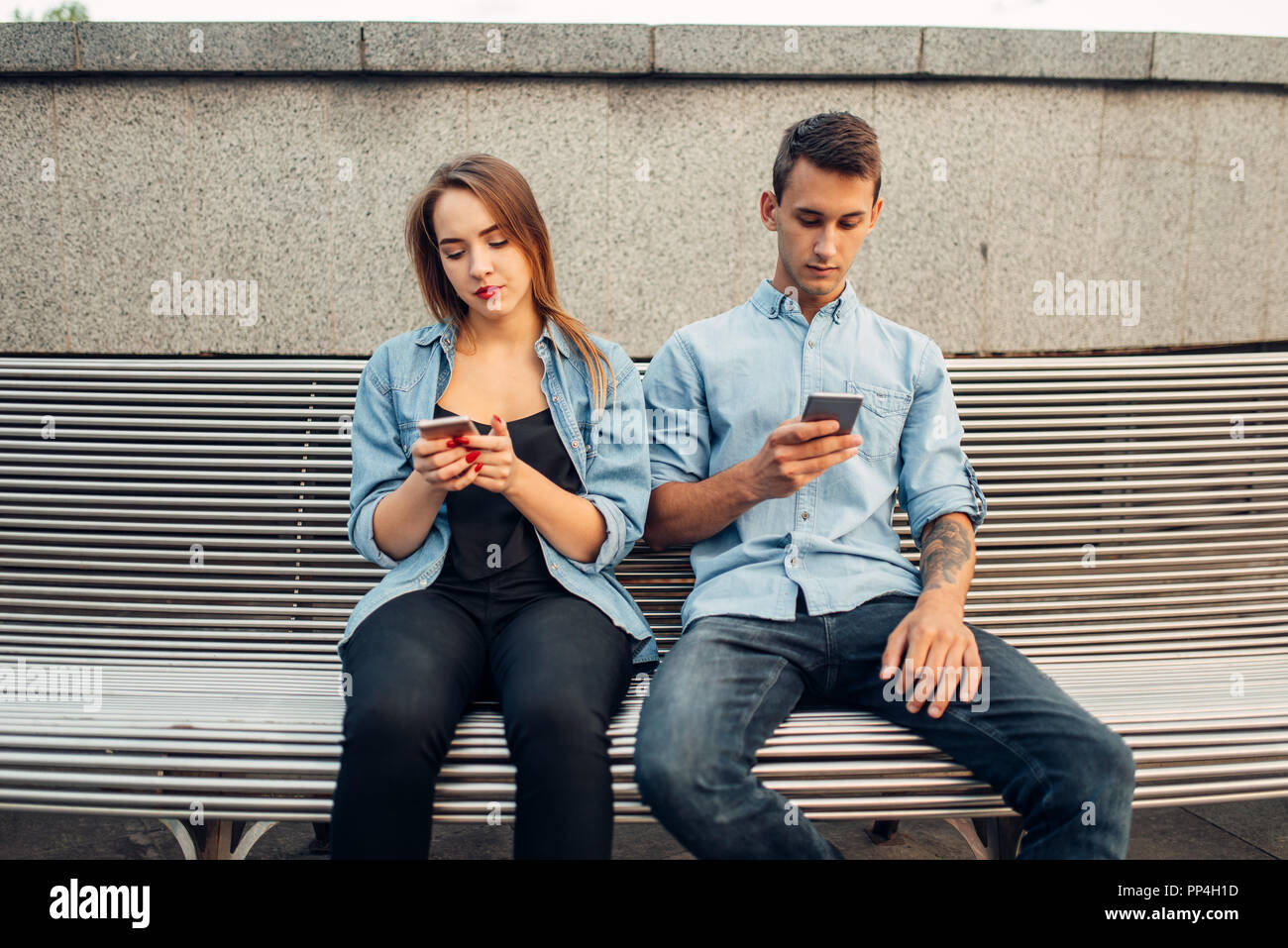 Phone Addiction Young Couple On The Bench In Park Man And Woman