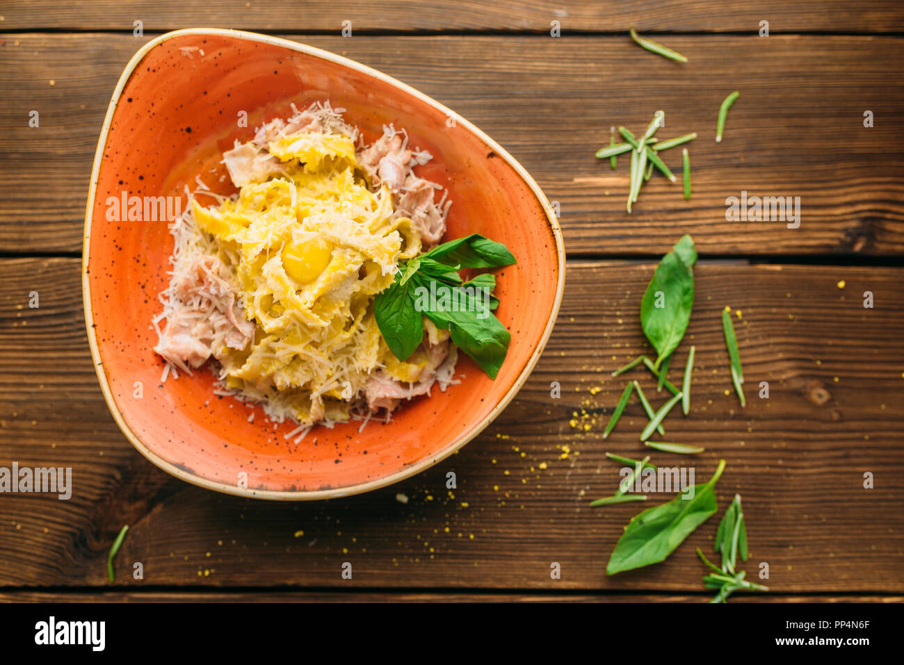 Pasta and meat in a bowl on wooden table closeup, nobody. Second dish, food preparation, cooking Stock Photo