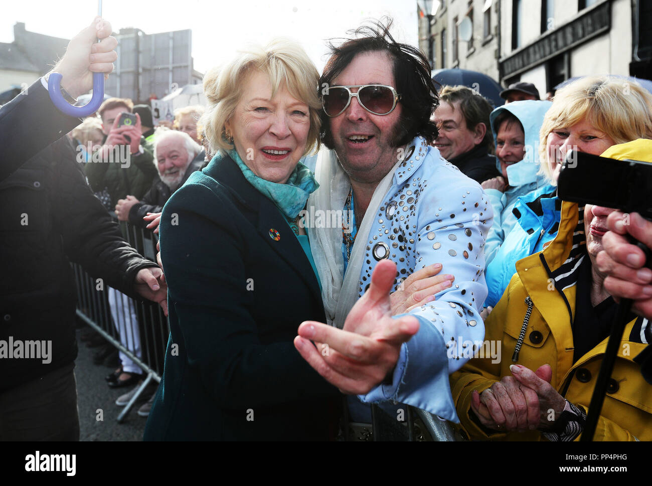 Sabina Higgins is greeted by Myles Kavanagh 'The Kilkenny Elvis' at the  official unveiling of a statue of late country singer Big Tom McBride in  Castleblaney as the inaugural festival in his